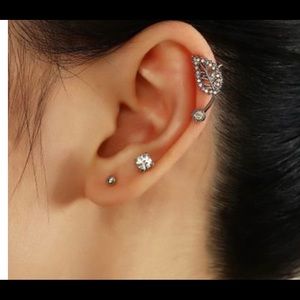 Silver shaped non pierced earring.